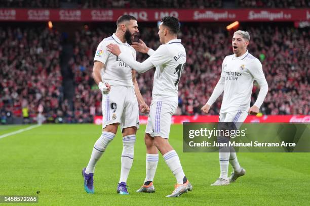 Karim Benzema celebrates with Dani Ceballos of Real Madrid after scoring the team's first goal during the LaLiga Santander match between Athletic...