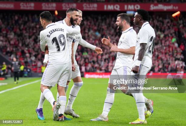 Karim Benzema celebrates with Dani Ceballos of Real Madrid after scoring the team's first goal during the LaLiga Santander match between Athletic...