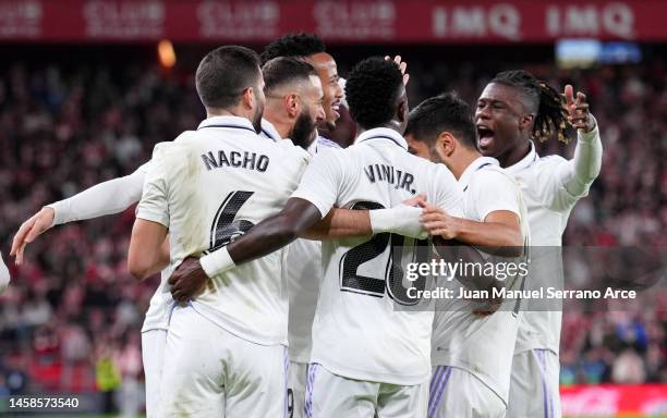 Karim Benzema of Real Madrid celebrates with teammates after scoring the team's second goal during the LaLiga Santander match between Athletic Club...