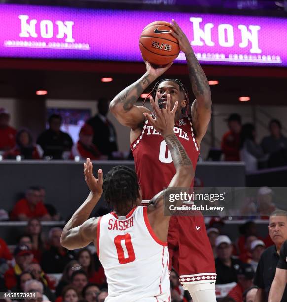 Khalif Battle of the Temple Owls shoots over Marcus Sasser of the Houston Cougars during the first half at Fertitta Center on January 22, 2023 in...