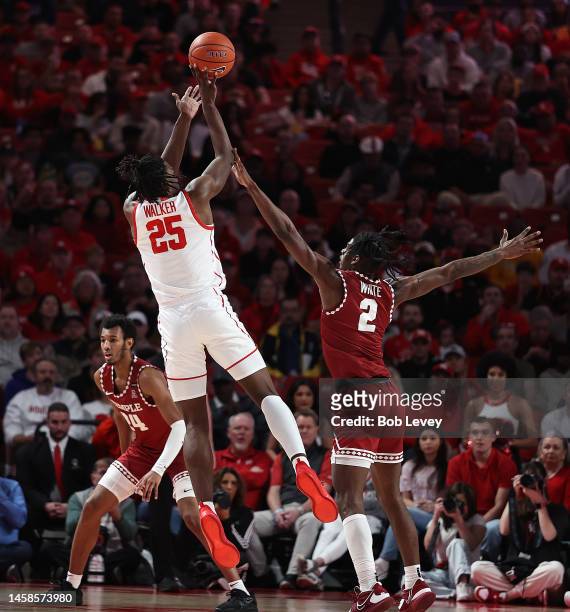 Jarace Walker of the Houston Cougars shoots over Jahlil White of the Temple Owls during the first half at Fertitta Center on January 22, 2023 in...