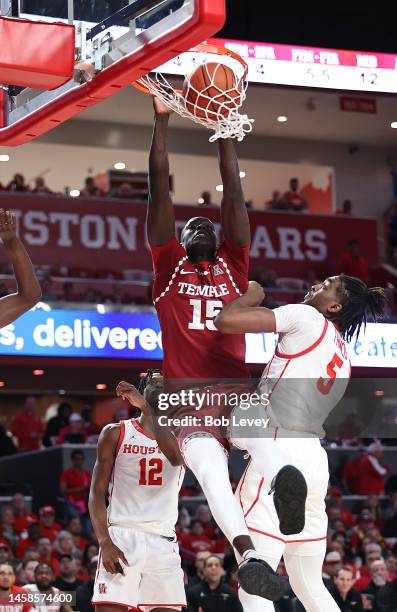 Kur Jongkuch of the Temple Owls dunks over Ja'Vier Francis of the Houston Cougars and Terrance Arceneaux during the first half at Fertitta Center on...