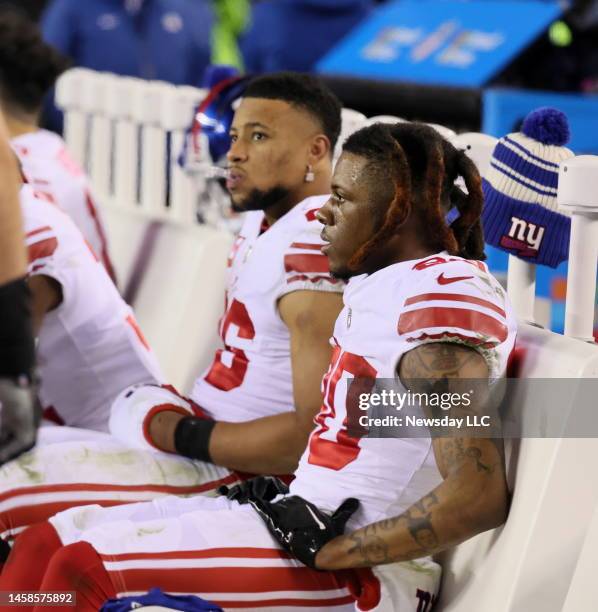 New York Giants running back Saquon Barkley and New York Giants wide receiver Richie James on the bench near the end of the game during the NFC...