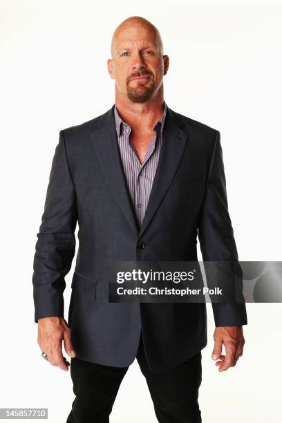 Steve Austin poses in the Wonderwall.com.com Portrait Studio during 2012 CMT Music awards at the Bridgestone Arena on June 6, 2012 in Nashville,...