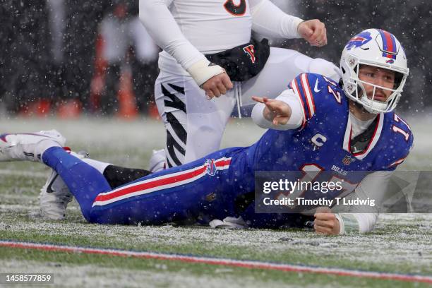 Josh Allen of the Buffalo Bills reacts after being tackled against the Cincinnati Bengals during the first quarter in the AFC Divisional Playoff game...