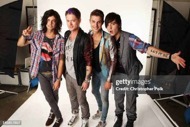 Ian Keaggy, Nash Overstreet, Ryan Follese, and Jamie Follese of Hot Chelle Rae pose in the Wonderwall.com.com Portrait Studio during 2012 CMT Music...