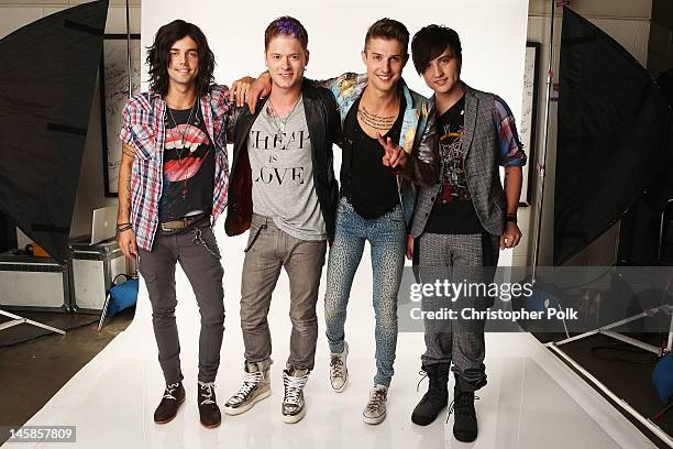 Ian Keaggy, Nash Overstreet, Ryan Follese, and Jamie Follese of Hot Chelle Rae pose in the Wonderwall.com.com Portrait Studio during 2012 CMT Music...