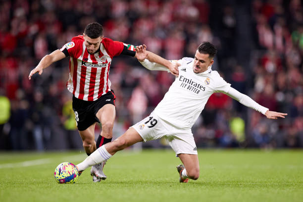Oscar de Marcos of Athletic Club competes for the ball with Dani Ceballos of Real Madrid CF during the La Liga Santander match between Athletic Club...