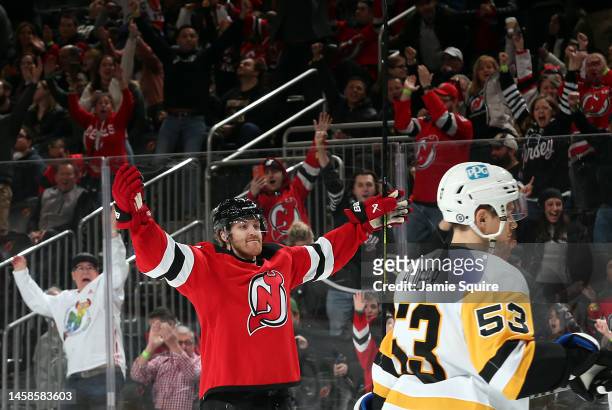 Dougie Hamilton of the New Jersey Devils celebrates after scoring the game-winning goal in overtime to win the game against the Pittsburgh Penguins...