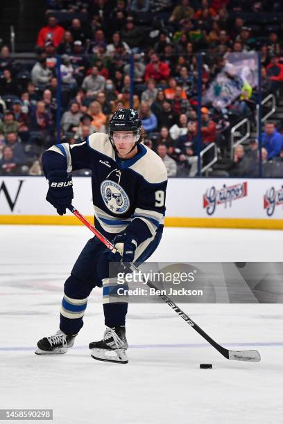 Kent Johnson of the Columbus Blue Jackets skates with the puck during the third period of a game against the Anaheim Ducks at Nationwide Arena on...