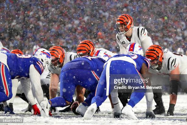 Joe Burrow of the Cincinnati Bengals calls a play against the Buffalo Bills during the third quarter in the AFC Divisional Playoff game at Highmark...