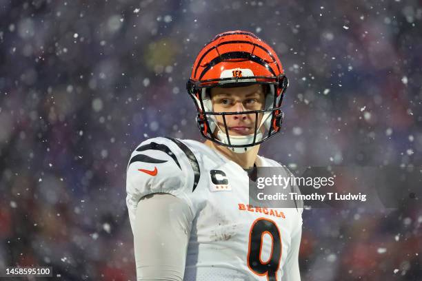 Joe Burrow of the Cincinnati Bengals looks on against the Buffalo Bills during the third quarter in the AFC Divisional Playoff game at Highmark...