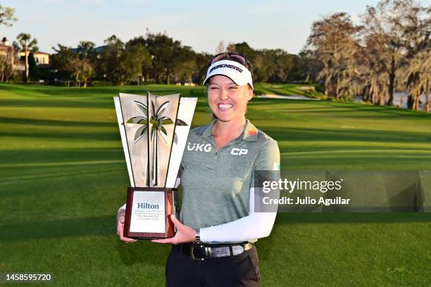 Brooke Henderson of Canada poses with the trophy after winning the Hilton Grand Vacations Tournament of Champions at Lake Nona Golf & Country Club on...