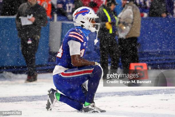 Stefon Diggs of the Buffalo Bills kneels on the ground after a play against the Cincinnati Bengals during the third quarter in the AFC Divisional...