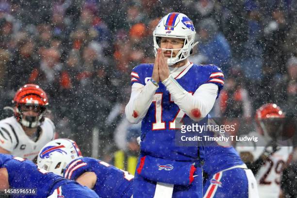 Josh Allen of the Buffalo Bills reacts against the Cincinnati Bengals during the third quarter in the AFC Divisional Playoff game at Highmark Stadium...