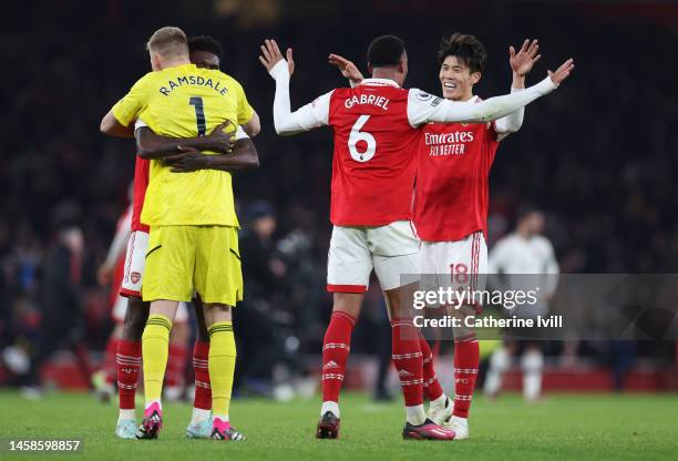 Takehiro Tomiyasu of Arsenal celebrates with Gabriel following the Premier League match between Arsenal FC and Manchester United at Emirates Stadium...