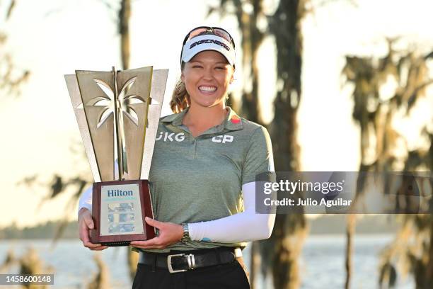 Brooke Henderson of Canada poses with the trophy after winning the Hilton Grand Vacations Tournament of Champions at Lake Nona Golf & Country Club on...