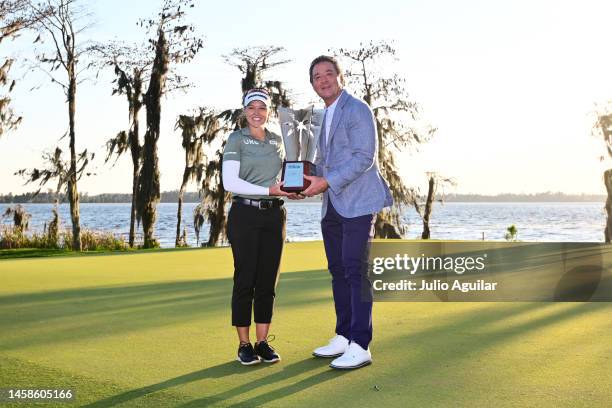 Brooke Henderson of Canada and Hilton Grand Vacation CEO Mark Wang pose with the trophy after the final round of the Hilton Grand Vacations...