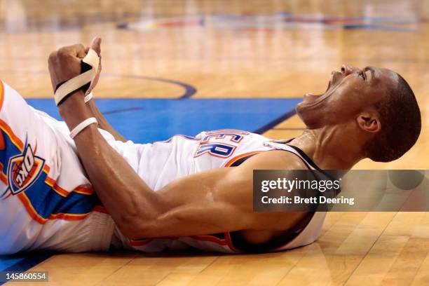 Russell Westbrook of the Oklahoma City Thunder reacts after getting fouled and making the basket against the San Antonio Spurs in Game Six of the...