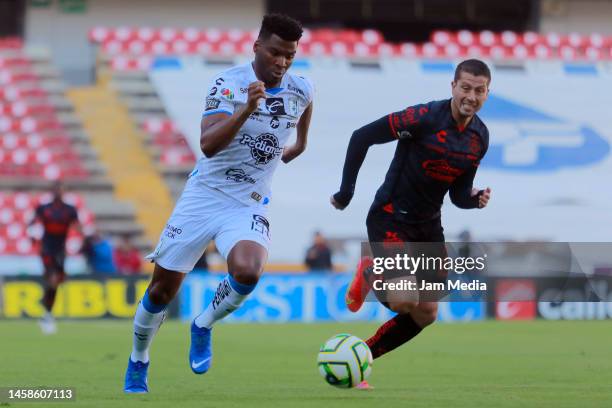 Jose Zuniga of Queretaro fights for the ball with Hugo Nervo of Atlas during the 3rd round match between Queretaro and Atlas as part of the Torneo...