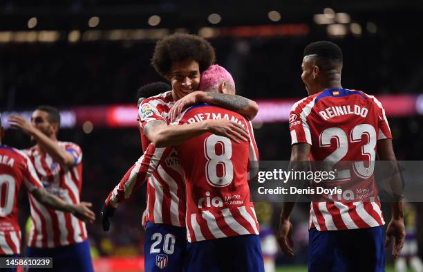 Antoine Griezmann of Atletico de Madrid celebrates with Axel Witsel after scoring their team's second goal during the LaLiga Santander match between...