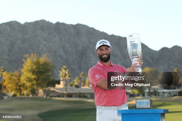 Jon Rahm of Spain celebrates with the trophy after winning during the final round of The American Express at PGA West Pete Dye Stadium Course on...