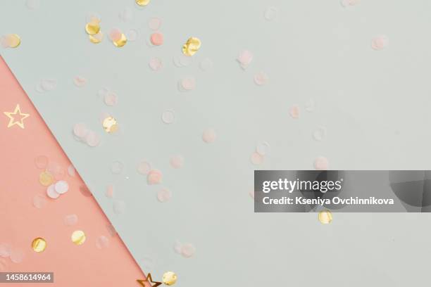 pink pastel festive background with confetti and sparkles. flat lay style. - pastel confetti stock pictures, royalty-free photos & images