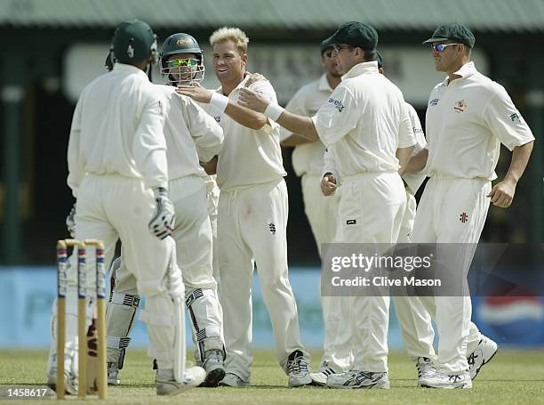 Shane Warne of Australia celebrates the wicket of Abdul Razzaq of Pakistan on day two of the first Test match between Pakistan and Australia at the...