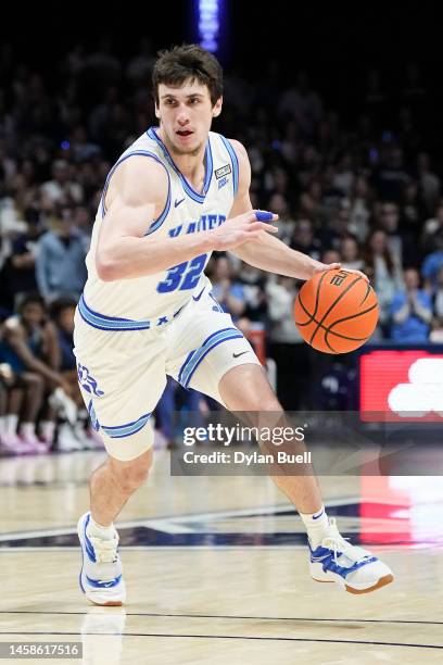 Zach Freemantle of the Xavier Musketeers dribbles the ball in the second half against the Georgetown Hoyas at the Cintas Center on January 21, 2023...