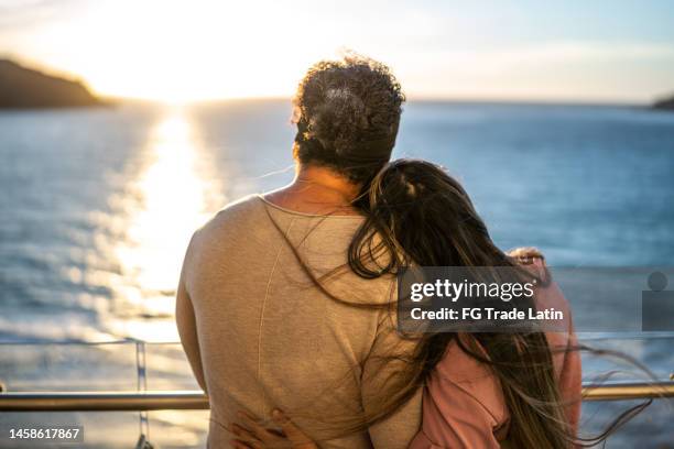 couple looking to the landscape during a cruise travel - couple on cruise ship stock pictures, royalty-free photos & images