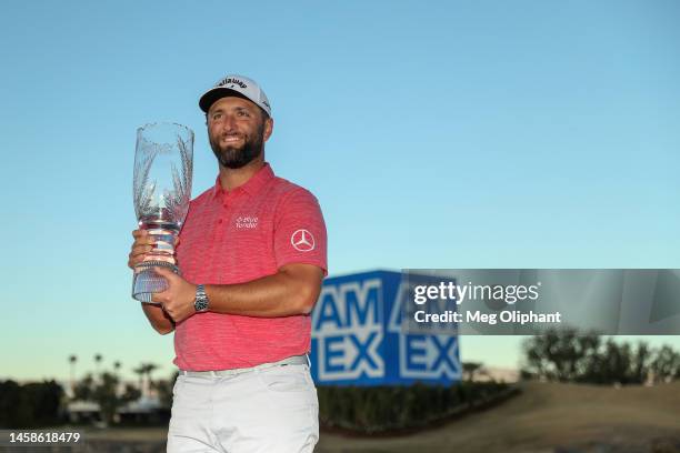 Jon Rahm of Spain celebrates with the trophy after winning during the final round of The American Express at PGA West Pete Dye Stadium Course on...