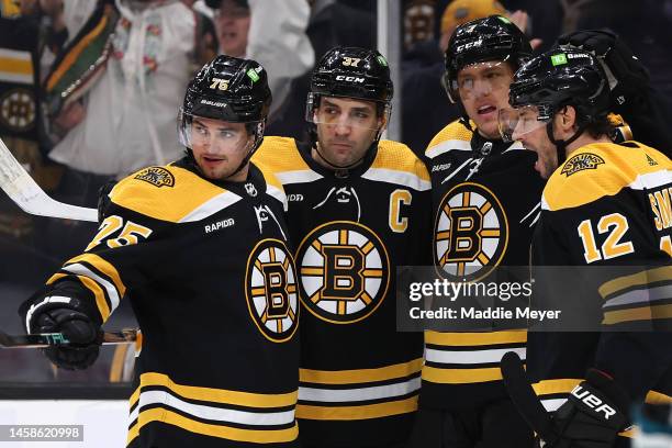 Hampus Lindholm of the Boston Bruins celebrates with Craig Smith, Patrice Bergeron and Connor Clifton of the Boston Bruins after scoring a goal...