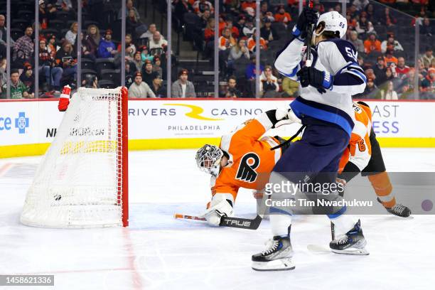 Mark Scheifele of the Winnipeg Jets scores past Felix Sandstrom of the Philadelphia Flyers during the first period at Wells Fargo Center on January...