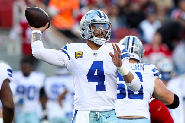 Dak Prescott of the Dallas Cowboys throws a pass against the San Francisco 49ers during the second quarter in the NFC Divisional Playoff game at...