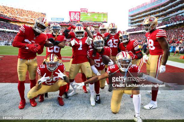 Fred Warner of the San Francisco 49ers celebrates with teammates after an interception against the Dallas Cowboys during the second quarter of the...