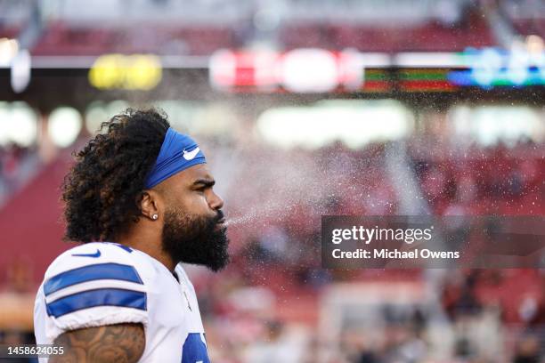 Ezekiel Elliott of the Dallas Cowboys sprays water from his mouth prior to an NFL divisional round playoff football game between the San Francisco...