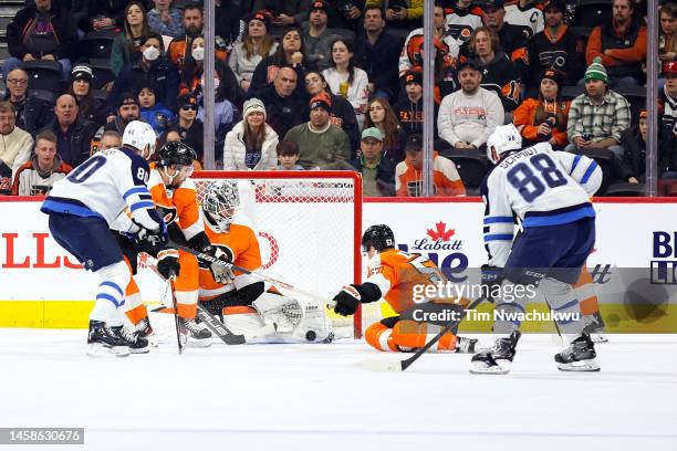 Felix Sandstrom of the Philadelphia Flyers blocks a shot during the second period against the Winnipeg Jets at Wells Fargo Center on January 22, 2023...