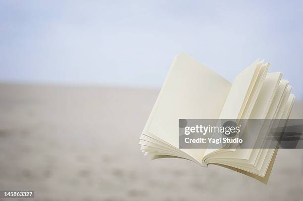 book is floating in the air - books and book open nobody stock pictures, royalty-free photos & images