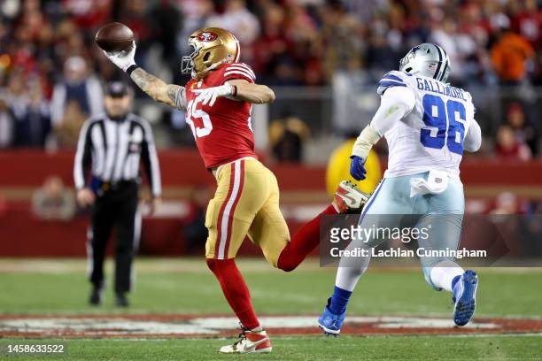 George Kittle of the San Francisco 49ers catches a pass against the Dallas Cowboys during the third quarter in the NFC Divisional Playoff game at...