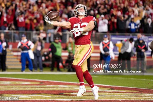 Christian McCaffrey of the San Francisco 49ers celebrates after rushing for a touchdown against the Dallas Cowboys during the fourth quarter in the...