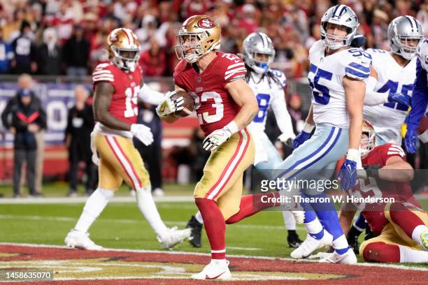 Christian McCaffrey of the San Francisco 49ers rushes for a touchdown against the Dallas Cowboys during the fourth quarter in the NFC Divisional...