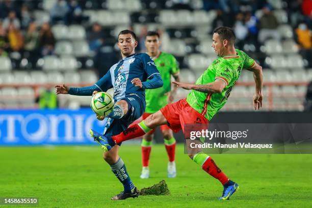 Luis Chávez of Pachuca struggles for the ball against Jesús Dueñas of Juarez FC during the 3rd round match between Pachuca and FC Juarez as part of...