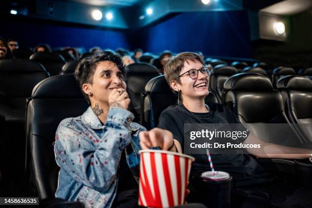 trans man with his girlfriend at the cinema - fashion meets movie stock pictures, royalty-free photos & images