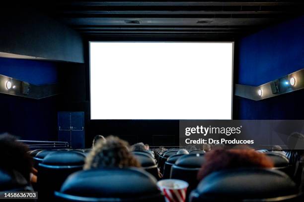 people watching at the cinema - projection screen stockfoto's en -beelden