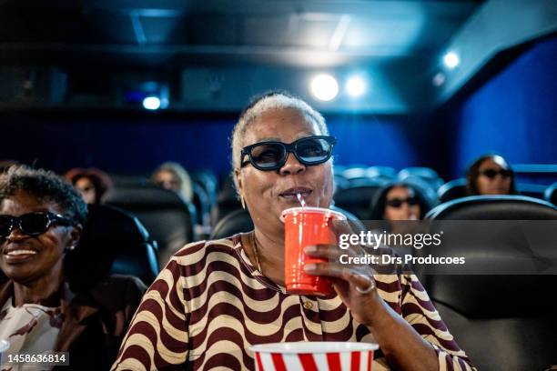 elderly women with 3d glasses at the cinema - old cinema stock pictures, royalty-free photos & images