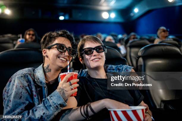 trans man with his girlfriend at the cinema - fashion meets movie stock pictures, royalty-free photos & images