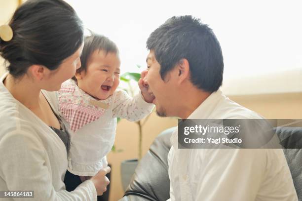 family enjoying day in the room. - japanese baby photos et images de collection