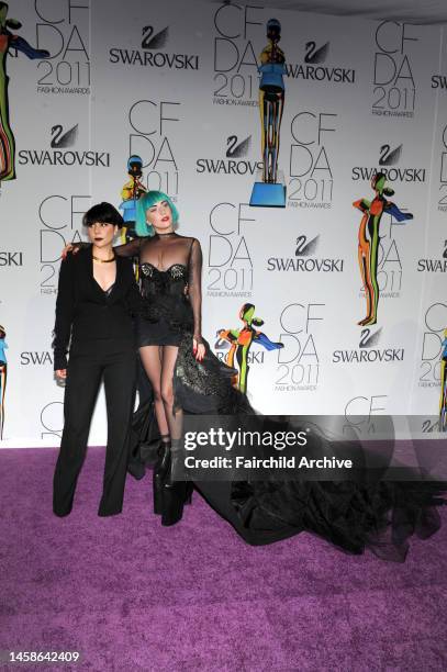 Natali Germanotta and Lady Gaga attend the Council of Fashion Designers of America's 2011 Fashion Awards at Lincoln Center's Alice Tully Hall.