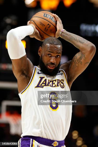 LeBron James of the Los Angeles Lakers looks to pass against the Portland Trail Blazers during the first half at Moda Center on January 22, 2023 in...