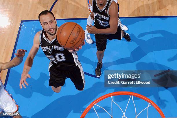 Manu Ginobili of the San Antonio Spurs goes to the basket against the Oklahoma City Thunder in Game Six of the Western Conference Finals during the...